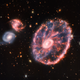 Imagen para el artículo titulado El Telescopio Espacial Webb saca una espectacular fotografía de la caótica galaxia Rueda de Carro